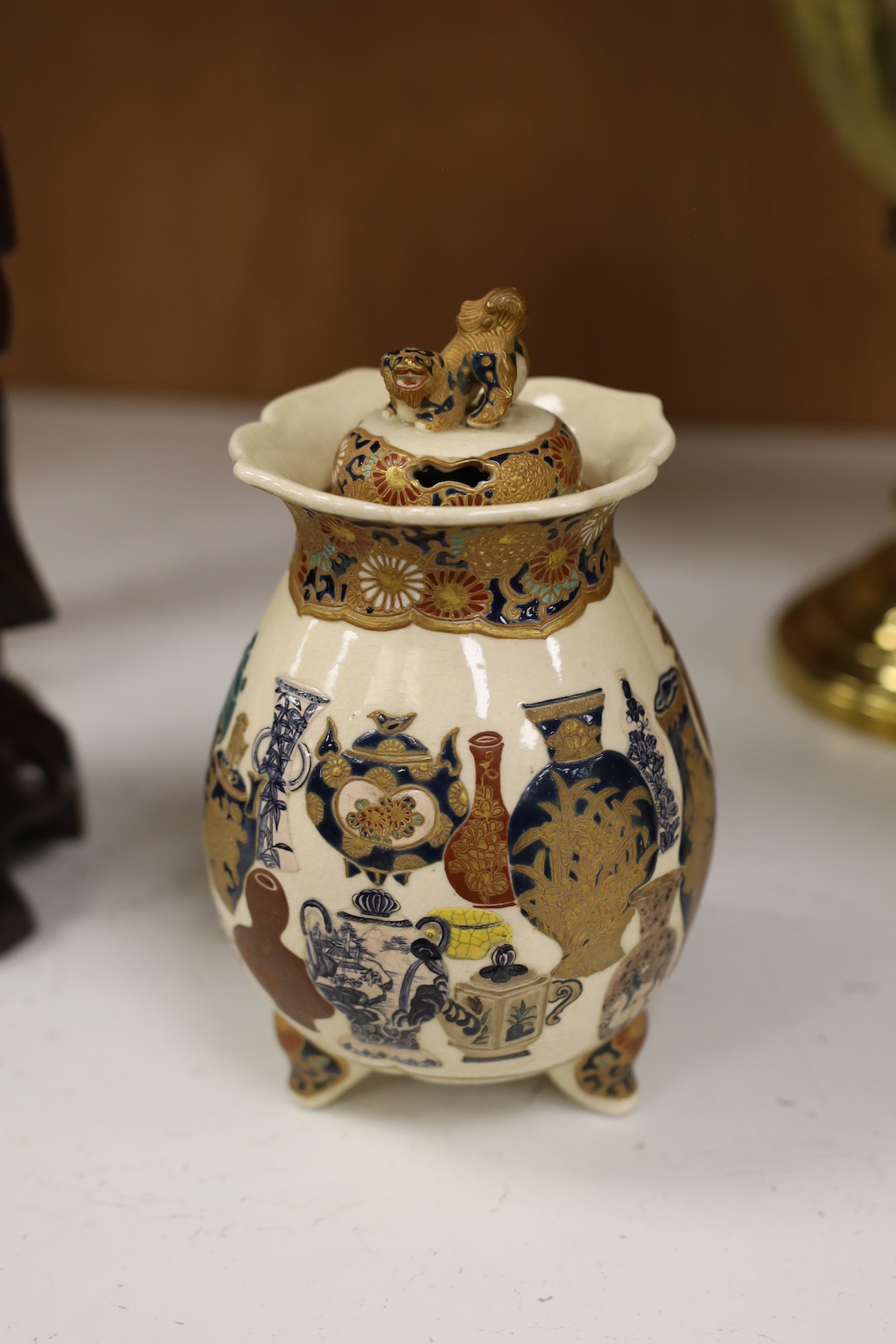 A late 19th century Japanese Satsuma ‘hundred antiques’ gosu blue pot pourri vase and three later items of Satsuma, including a bowl and cover a bowl on stand, a box and cover, tallest 18.5cm high. Condition - vase cover